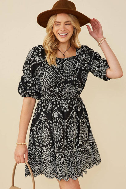 Black embroidered scallop hem mini dress detail