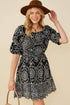 Black embroidered scallop hem mini dress detail