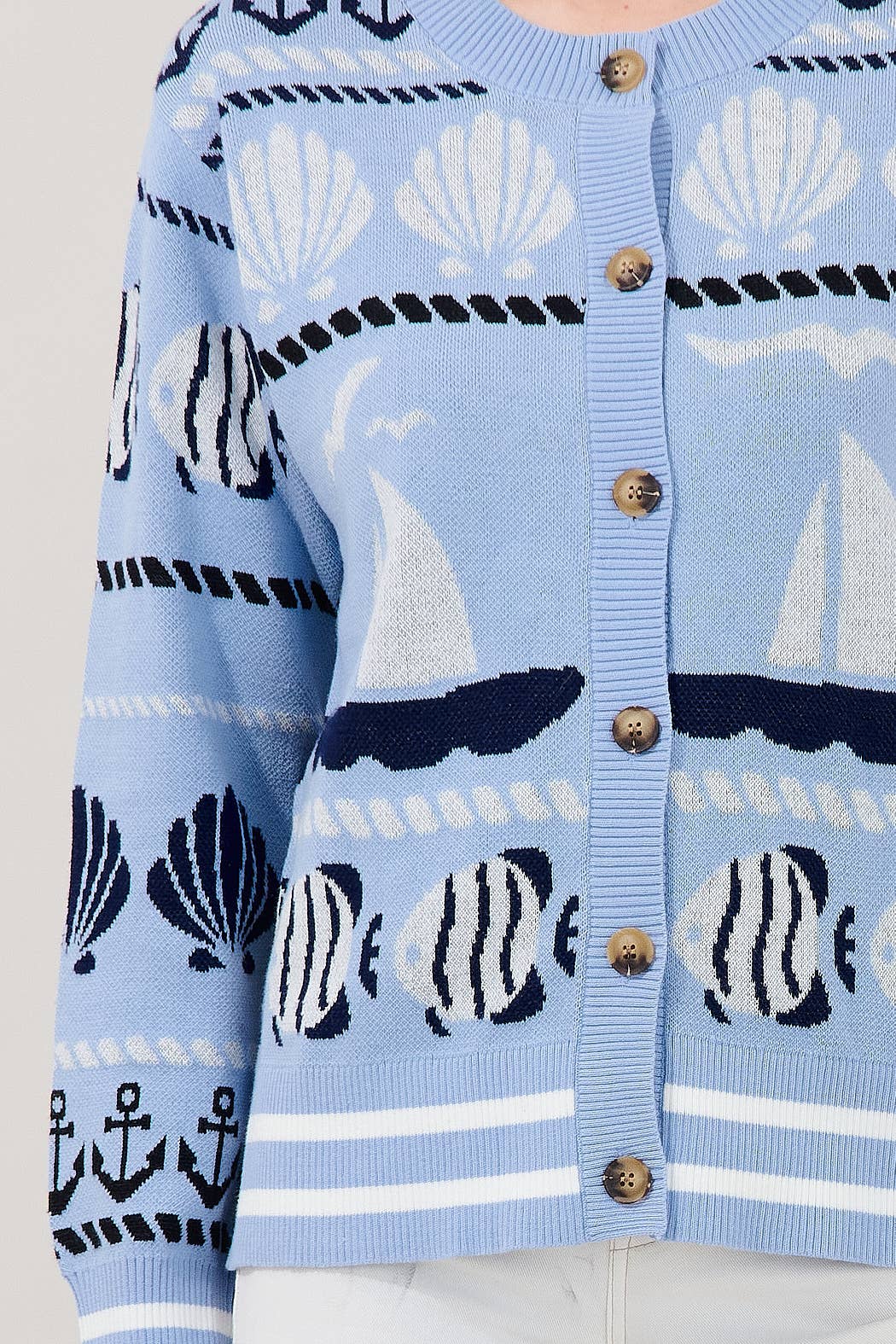 Blue nautical cardigan with sailboat and seashell details