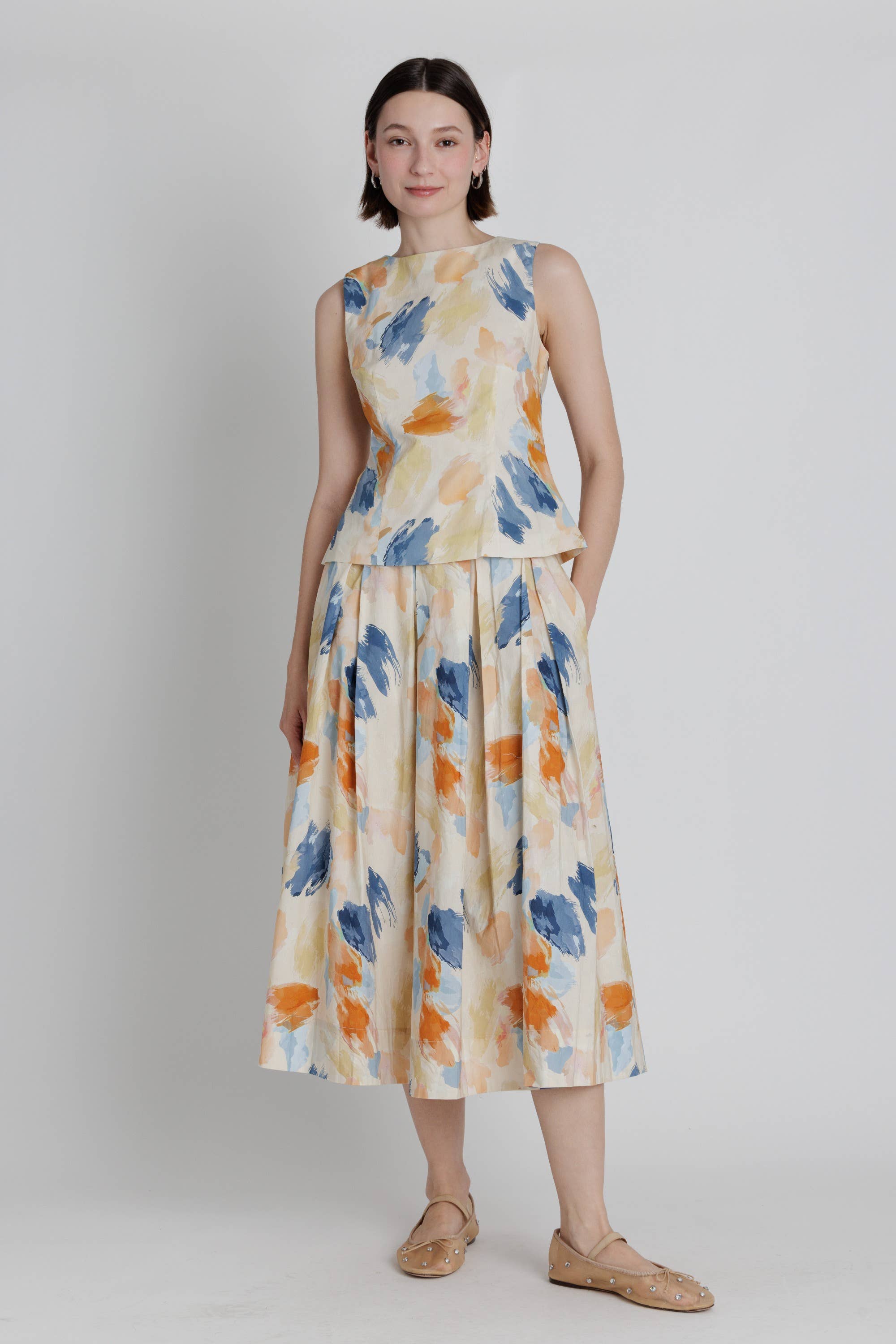 Colorful watercolor pleated midi skirt outfit detail