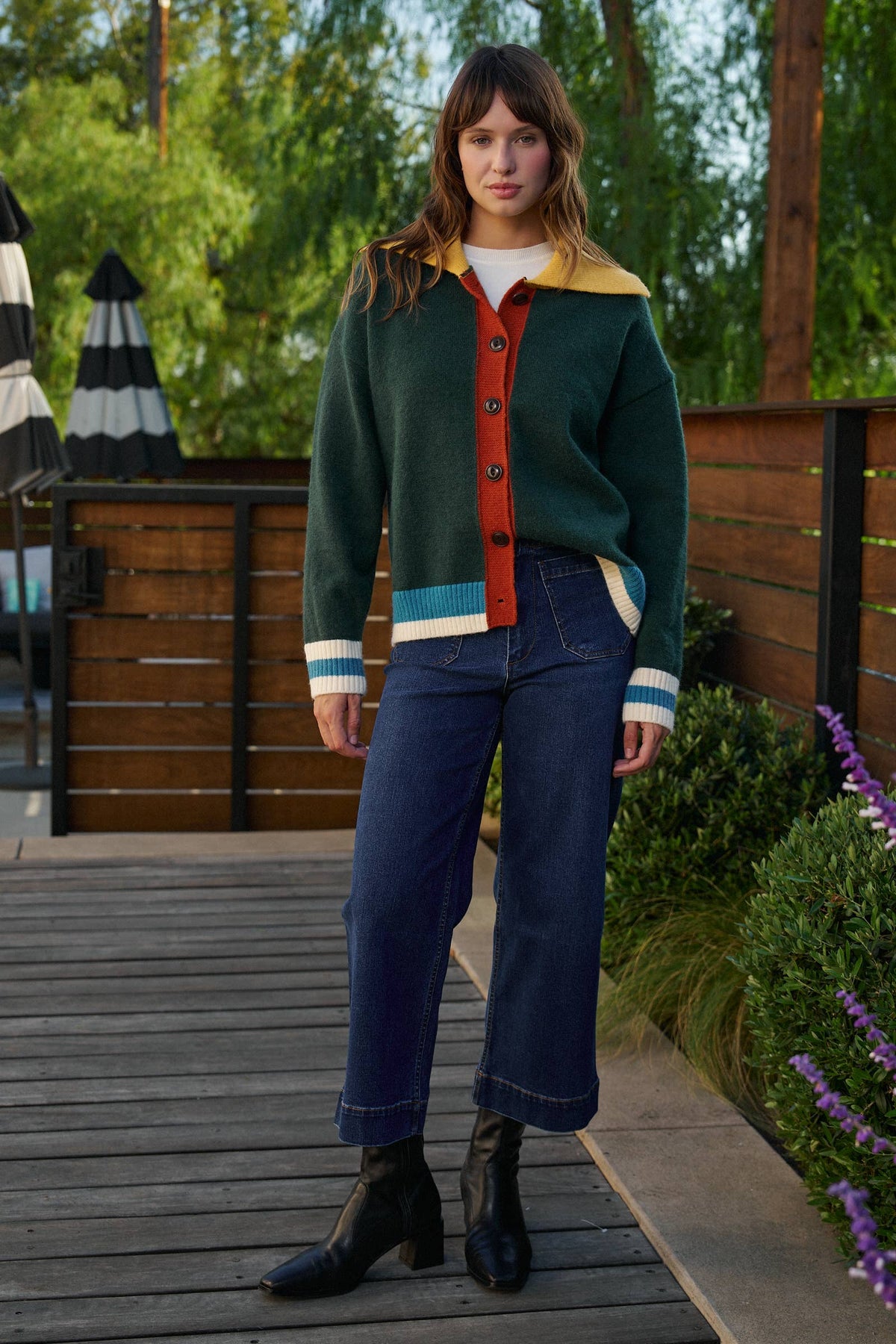 Forest green knit cardigan with colorful striped trim