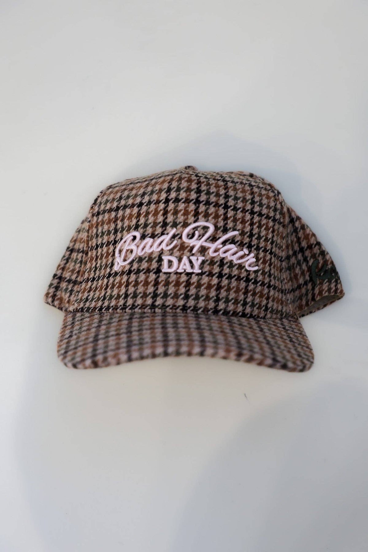 KAXI houndstooth tweed trucker hat front view
