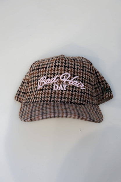 KAXI houndstooth tweed trucker hat front view
