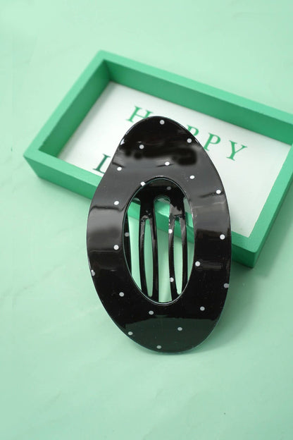 Lay flat polka dot hair claw clip styled in hair