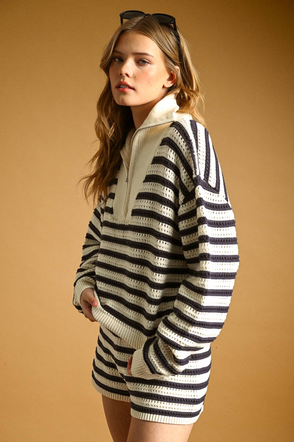 Navy and cream striped half zip knit sweater side view