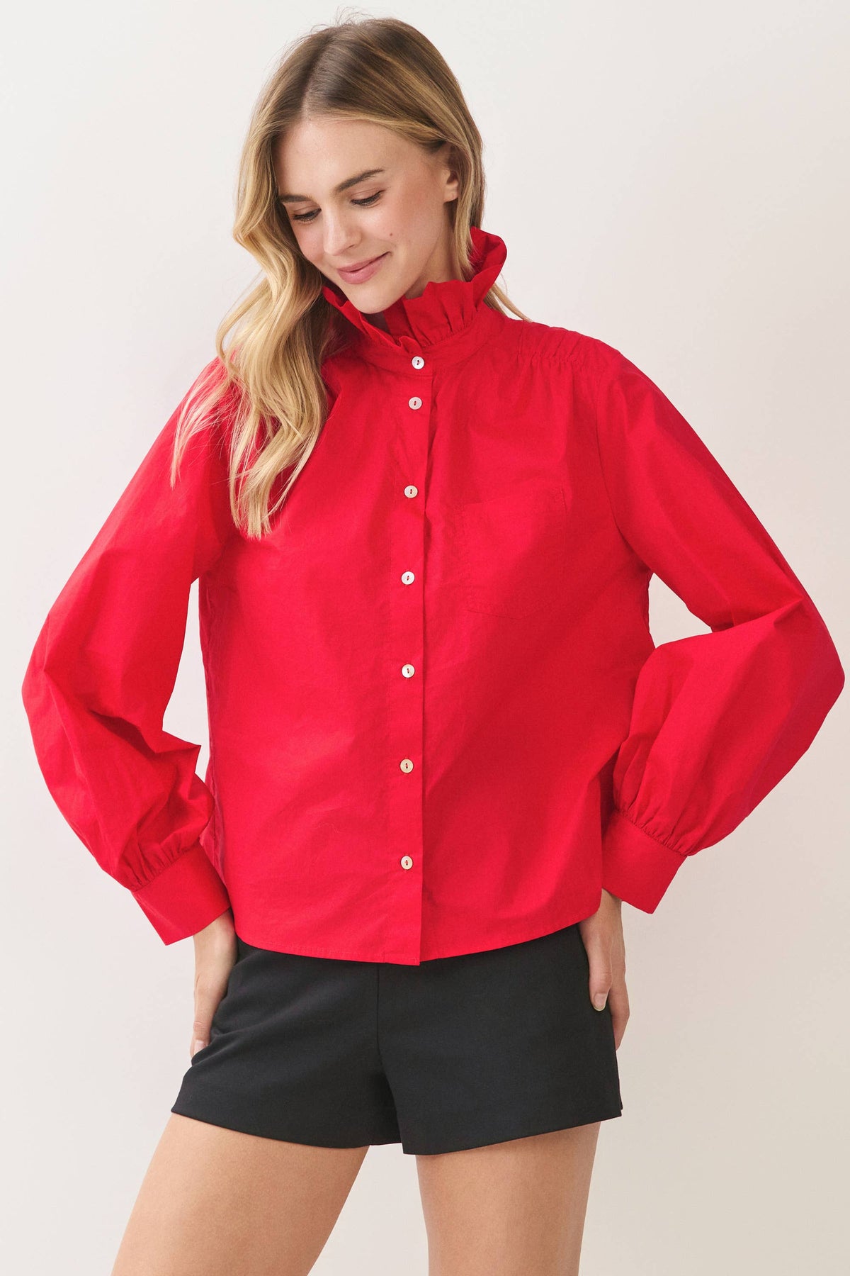 Red button-down shirt with high ruffle collar