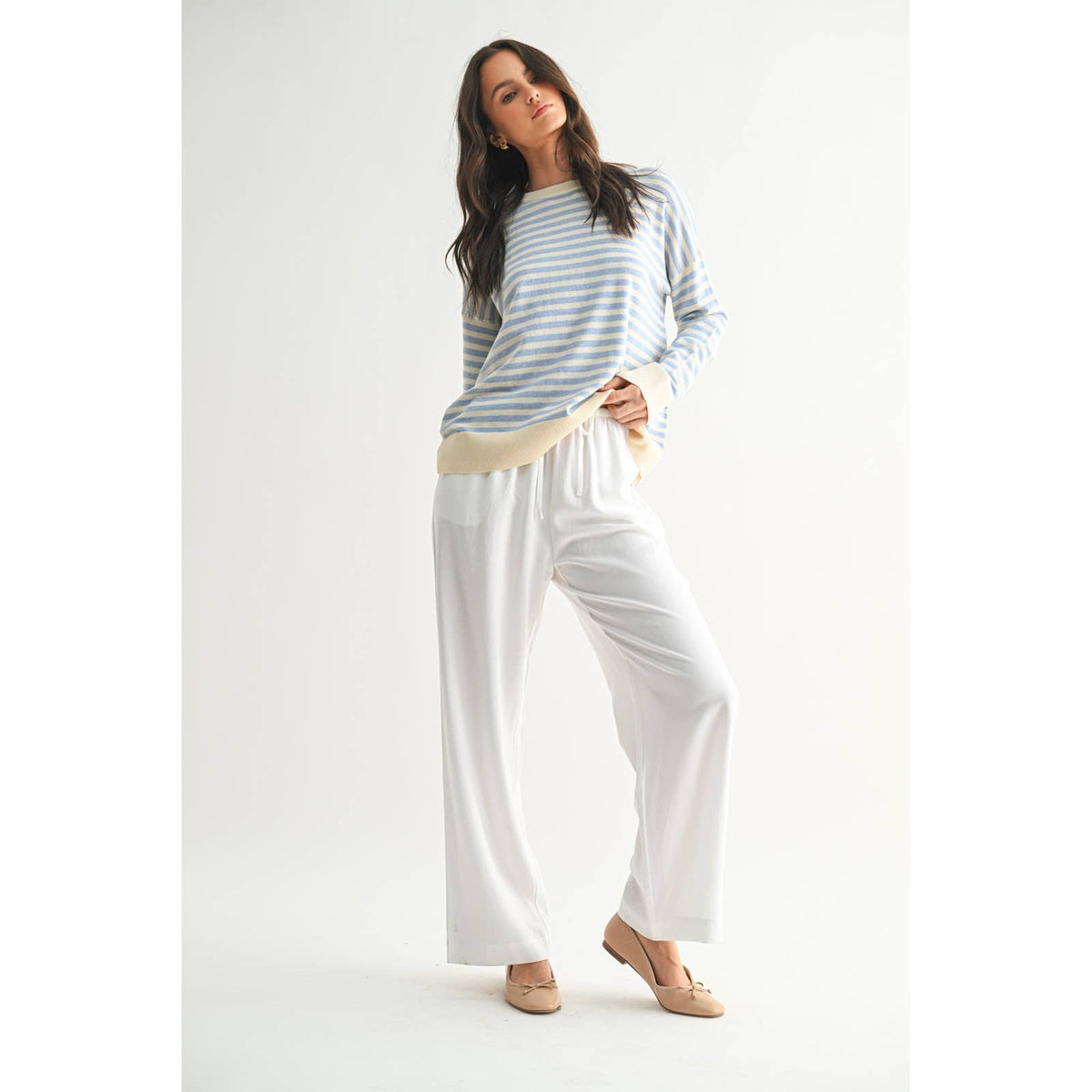 White linen straight leg pants styled on model