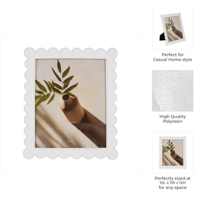 White resin scalloped edge picture frame styled with photo